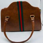 DESIGNER INSPIRED ROSIE FINE PRINT AFRICAN FABRIC AND LEATHER HAND BAG- BROWN.